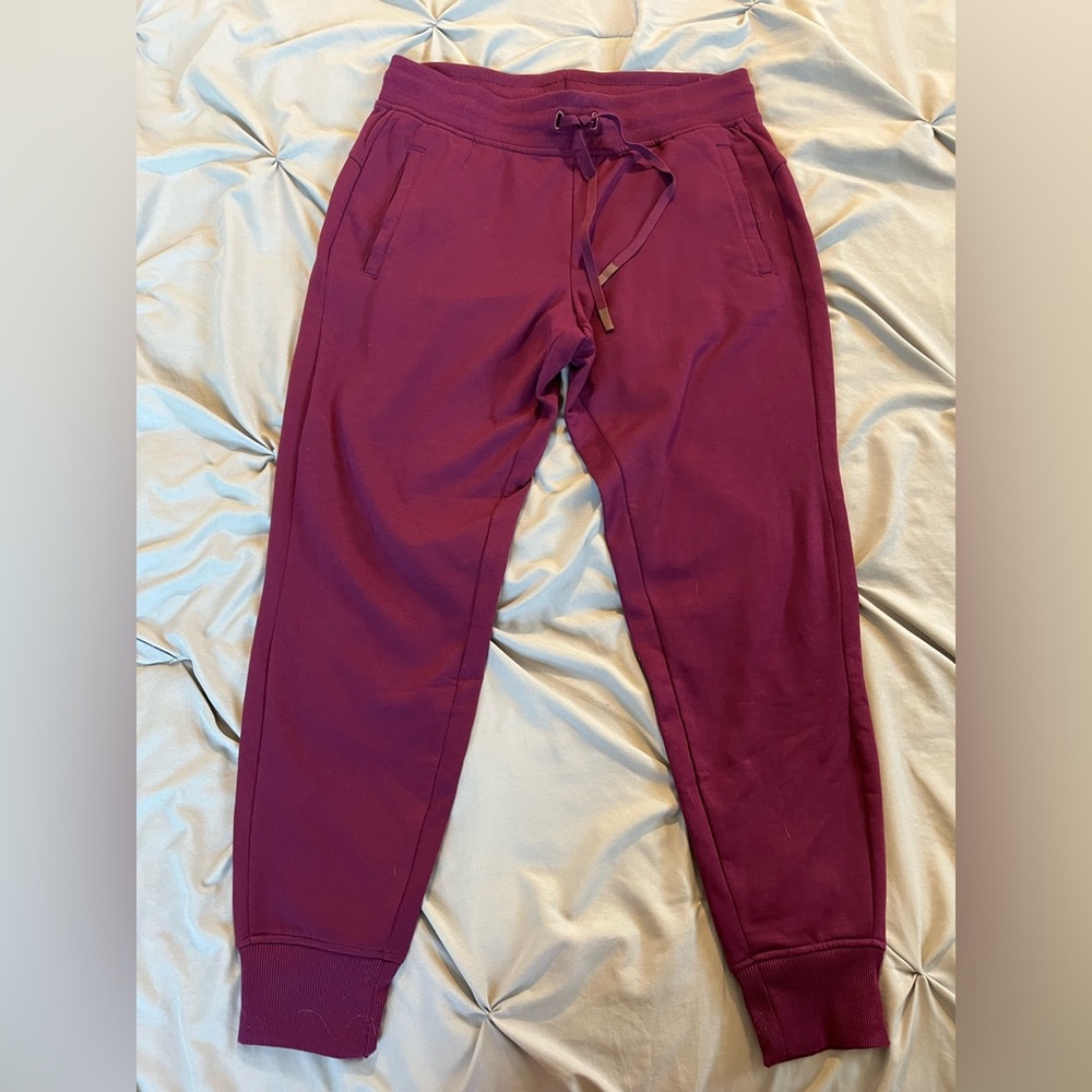 Red athletic pants.